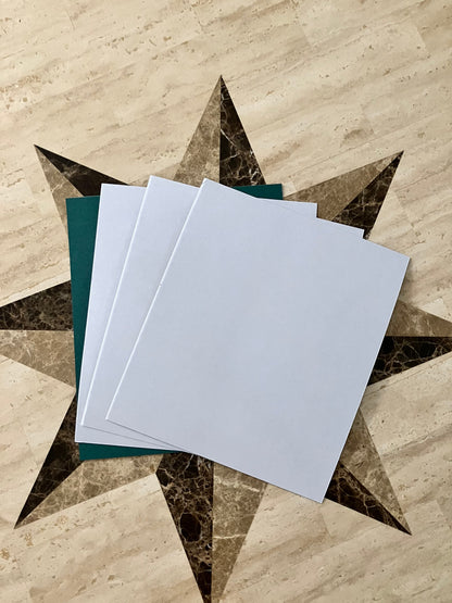 Set of four white adhesive-backed fish paper sheets, liner side shown, 10.5 x 9 inches